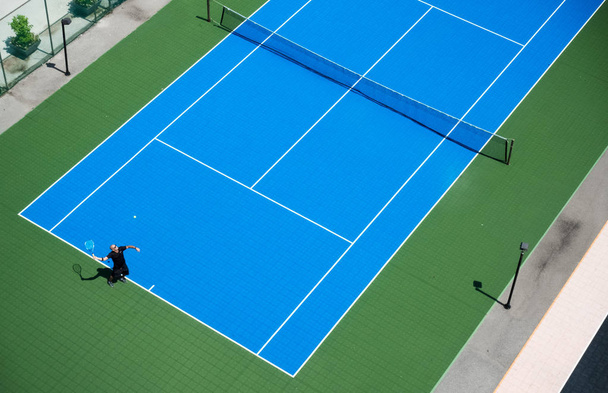 High angle view of man playing tennis, Toronto, Canada - Photo, Image