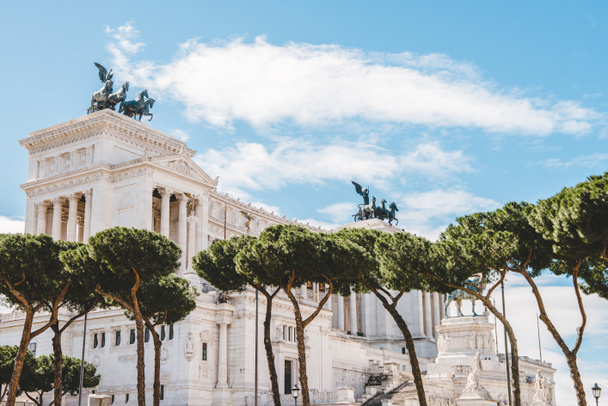 beautiful Altare della Patria (Altar of the Fatherland) with trees on foreground, Rome, Italy - Photo, Image