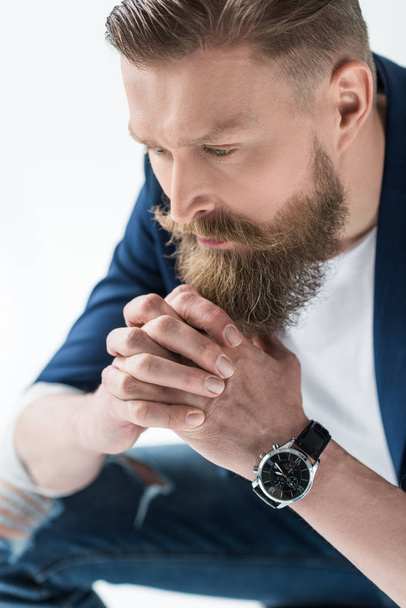 Handsome man in casual clothes wearing wristwatch isolated on light background - Valokuva, kuva