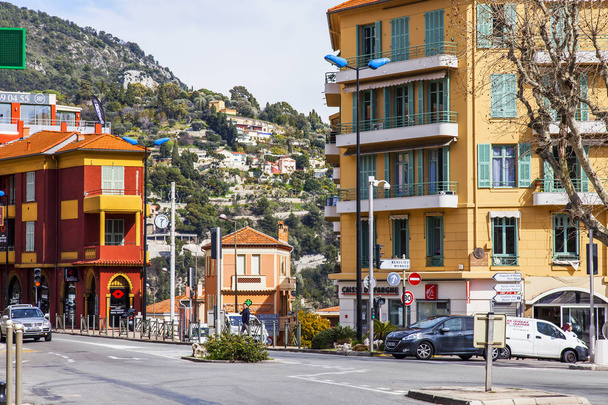 Villefranche-sur-Mer, FRANCE, on March 6, 2018. A picturesque urban view, the Street at the foot of the mountain - Photo, image