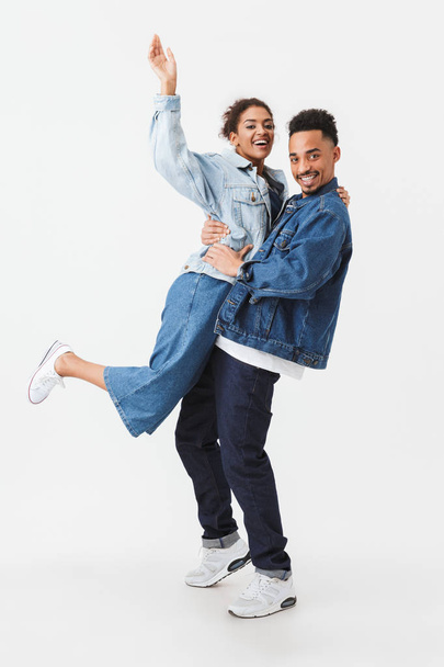 Full length image of Happy african couple in denim shirts - Foto, immagini