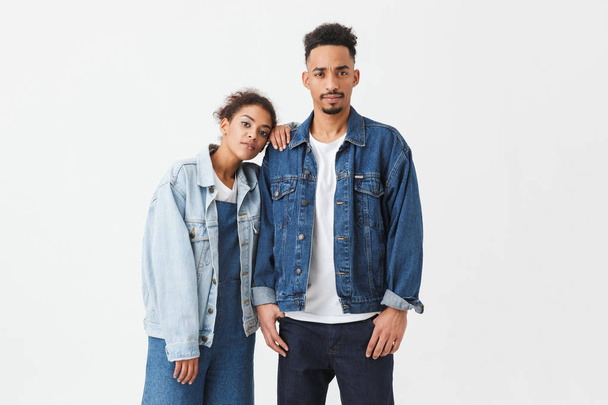 Young african couple in denim shirts posing together - Фото, зображення