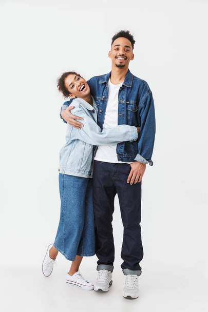Full length image of Laughing african couple in denim shirts - Foto, Imagen