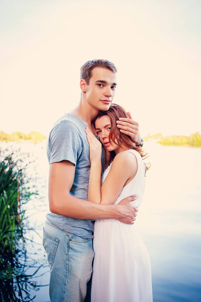 Couple in love hugging near the river walk outdoors - Fotoğraf, Görsel