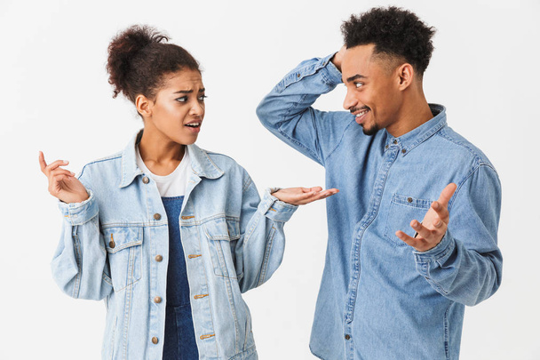 Pretty african couple in denim shirts quarrels between themselves - Photo, Image