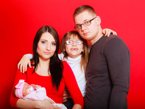 Toddler girl, father and mother holding newborn baby - Foto, Bild