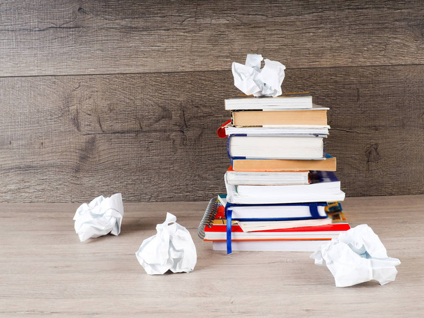 stack of books, crumpled paper, student preparing for exams - Фото, изображение