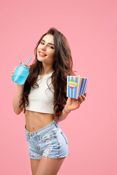 Attractive woman with jar and popcorn - Photo, image
