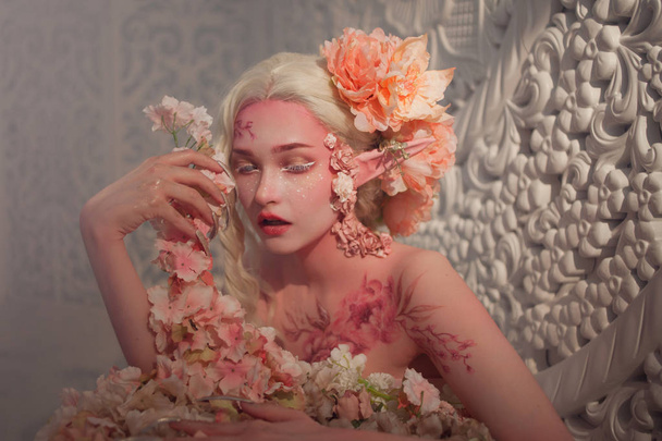 lovely she-elf among flowers. Creative make-up and bodyart - Foto, immagini