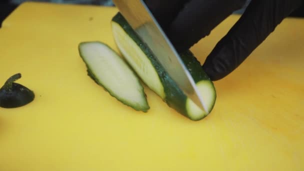 cook cuts cucumber - Video, Çekim