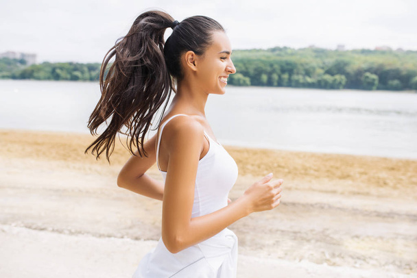 Beautiful portrait of brunette smile young woman runner in profi - Photo, Image