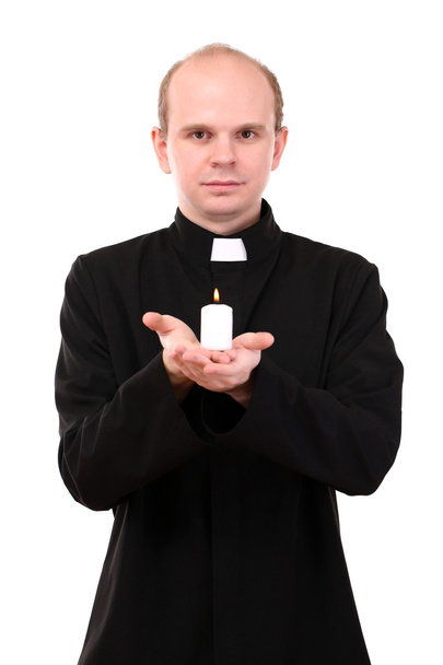 Portrait of young Pastor holding candle in his hand, isolated on white - Foto, Imagem