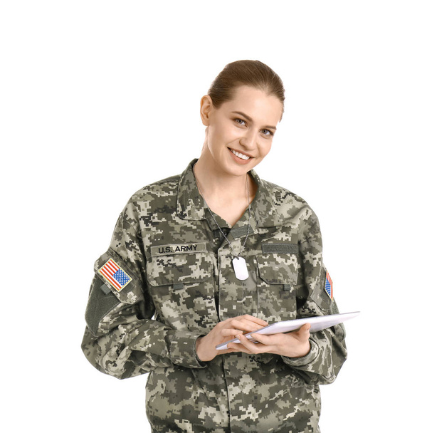 Female soldier using tablet computer on white background. Military service - Zdjęcie, obraz