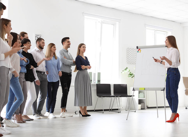 Female business trainer giving lecture in office - Foto, Bild
