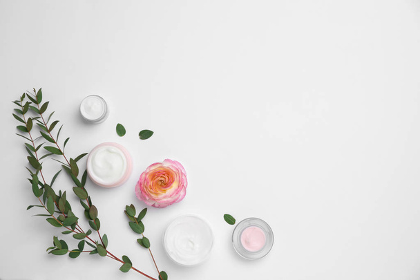 Flat lay composition with cosmetic products on light background - Valokuva, kuva
