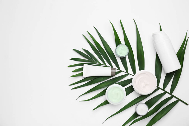 Flat lay composition with cosmetic products on light background - Foto, afbeelding