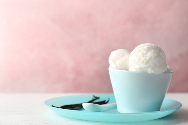 Bowl with tasty vanilla ice cream on table - Photo, image