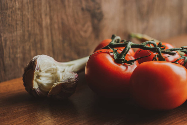 fresh tomatoes and garlic. Rustic concept - Photo, Image