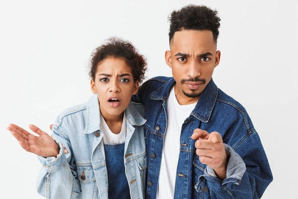 Serious confused african couple in denim shirts - Foto, Imagem