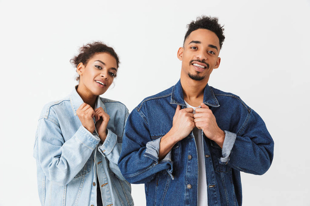 Young smiling african couple in denim shirts posing together - Foto, immagini