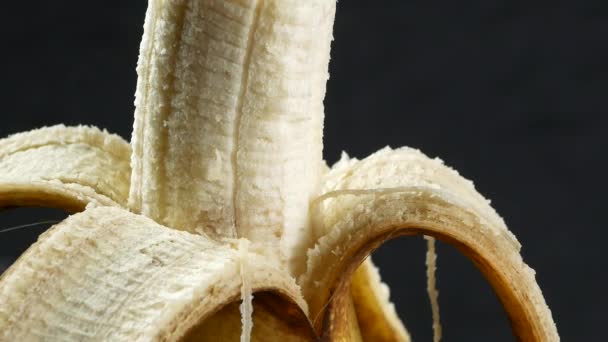 Banana skin extreme close up stock footage. Banana skin surface in macro close up with a sliding camera move - Materiał filmowy, wideo