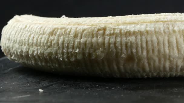 Banana skin extreme close up stock footage. Banana skin surface in macro close up with a sliding camera move - Πλάνα, βίντεο