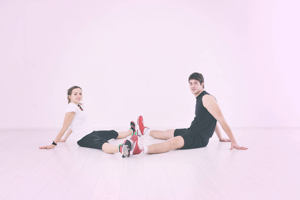 happy young couple fitness workout and fun at sport gym club - Φωτογραφία, εικόνα