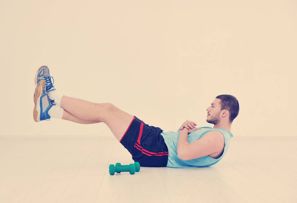 young man in fitness sport club exercise with weights and relaxing - Fotografie, Obrázek