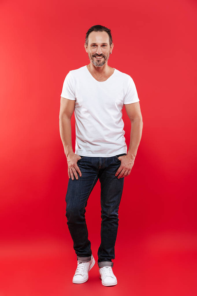 Cheerful adult man standing isolated - Photo, Image