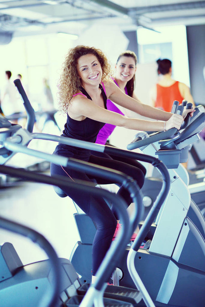 group of young people running on treadmills in modern sport  gym - Photo, Image
