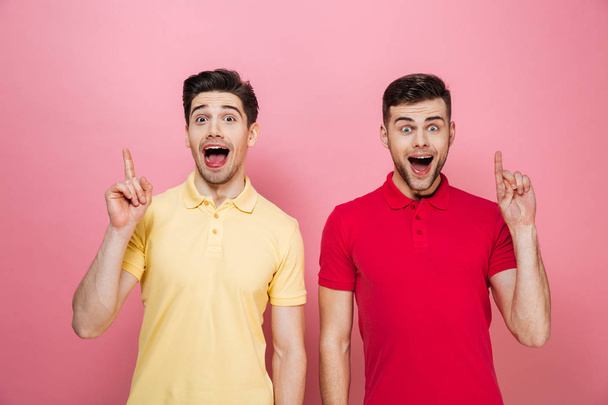 Portrait of a excited gay couple standing - Fotografie, Obrázek