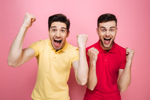 Portrait of an excited gay couple celebrating success - Foto, Imagem