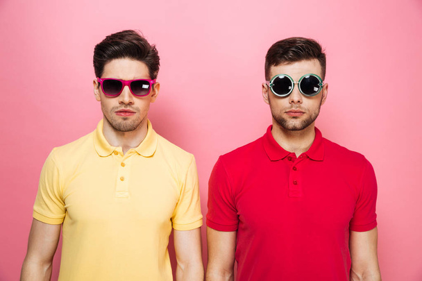 Portrait of a stylish gay male couple in sunglasses - Foto, afbeelding