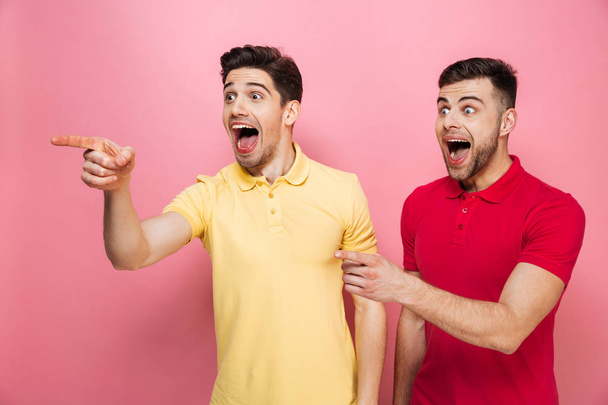 Portrait of a cheerful gay couple standing - Фото, зображення
