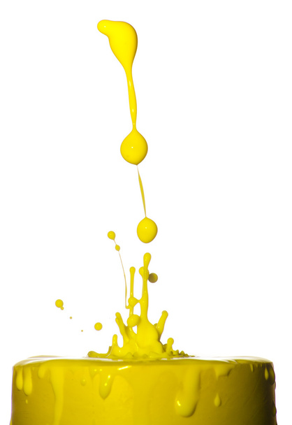 Splash of yellow liquid on white background - Photo, Image