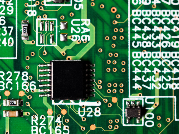 close-up of circuit board with integrated circuits, resistors and capacitors. - Photo, Image