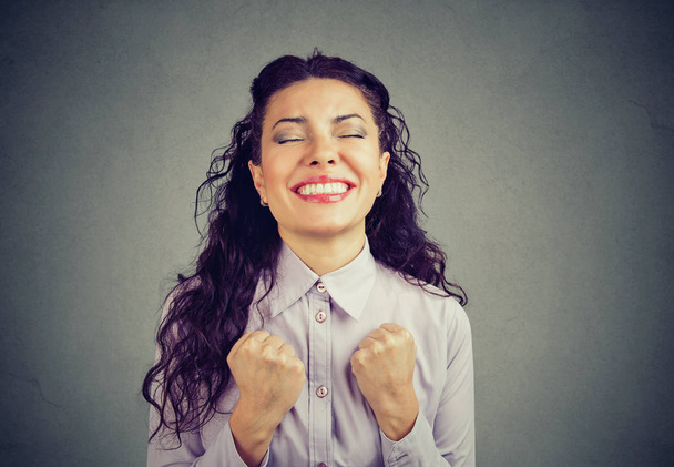 successful woman winning with fists pumped celebrating success - Photo, Image