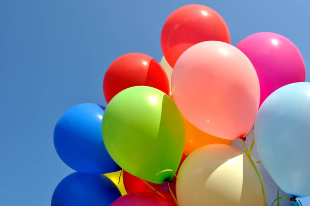 multicolored balloons  on blue sky background - Fotografie, Obrázek