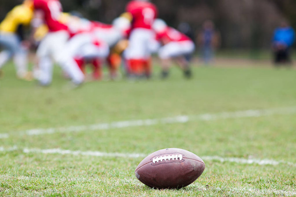 american football on the field - defocused players in the backgr - Photo, Image