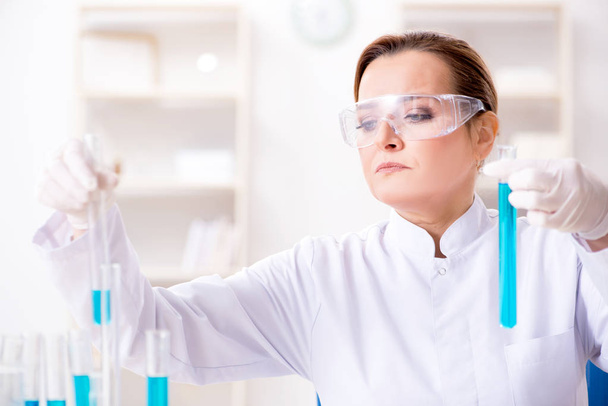 Woman chemist working in hospital clinic lab - Photo, Image