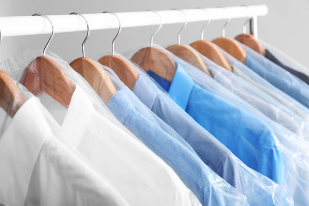 Rack with clean clothes on hangers after dry-cleaning - Foto, Imagem