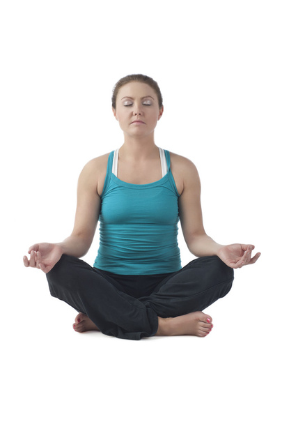 eine Frau in Lotus-Pose Yoga - Foto, Bild