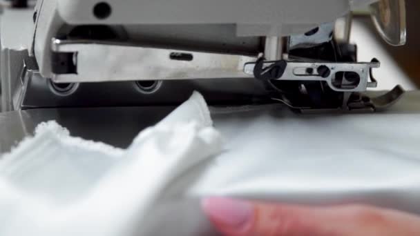 Close up on a sewing machine showing process - Footage, Video