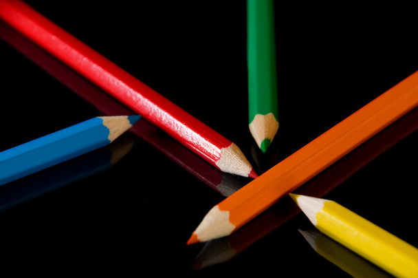 Color pencils on black - Foto, imagen