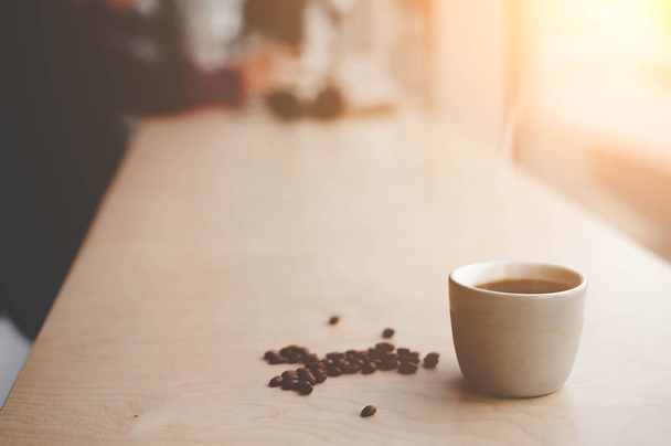 Hot coffee and coffee beans - Фото, зображення