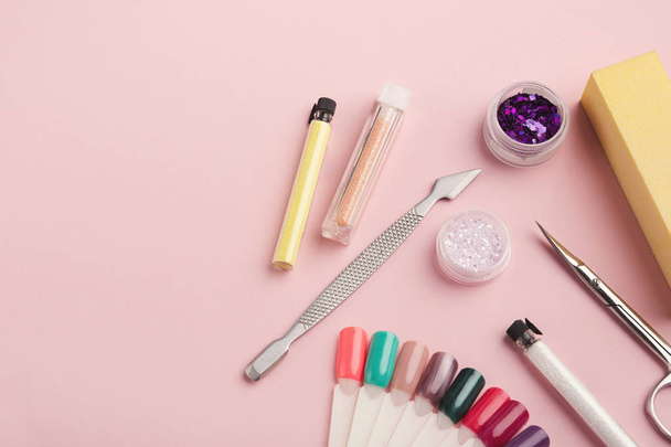 Manicure supplies on pink background - 写真・画像