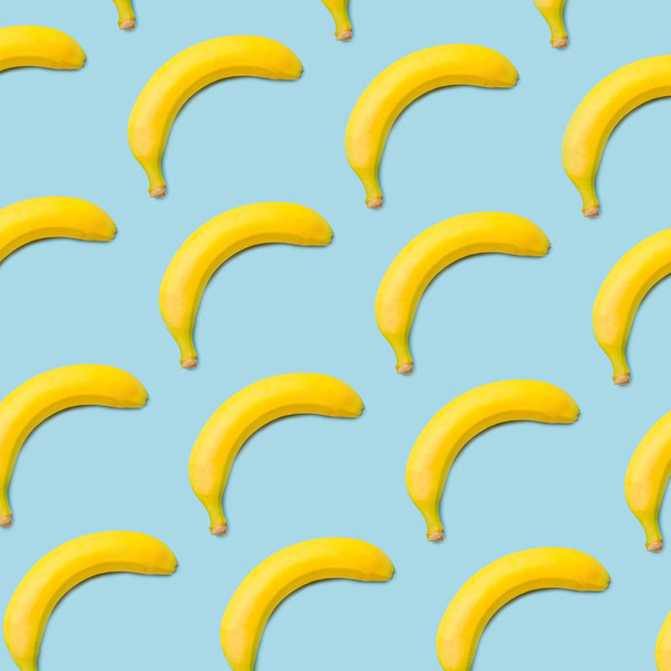 yellow bananas on a blue background - Foto, Imagem