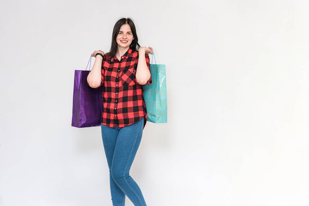 beautiful brunette girl holding packages from the store - Valokuva, kuva