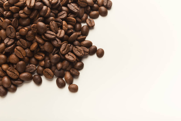 Heap of brown coffee beans isolated on white - Valokuva, kuva