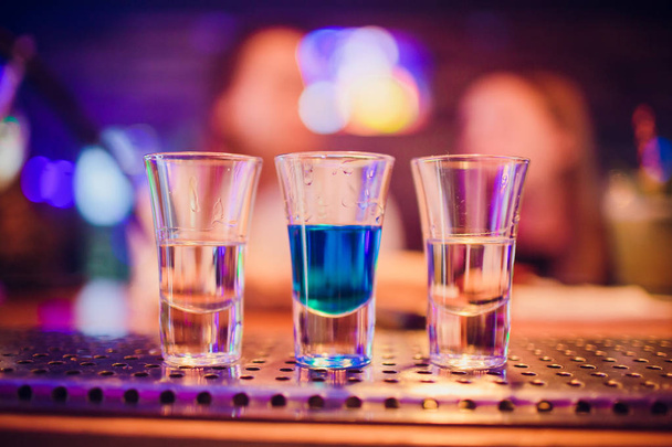 Multicolored shots on bar - Фото, зображення
